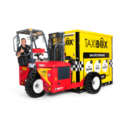 man driving forklift with taxibox
