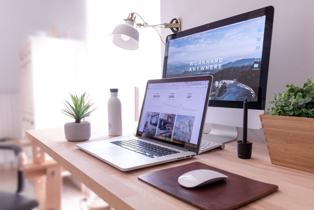 Clean, clutter-free desktop and macbook working from home set up 