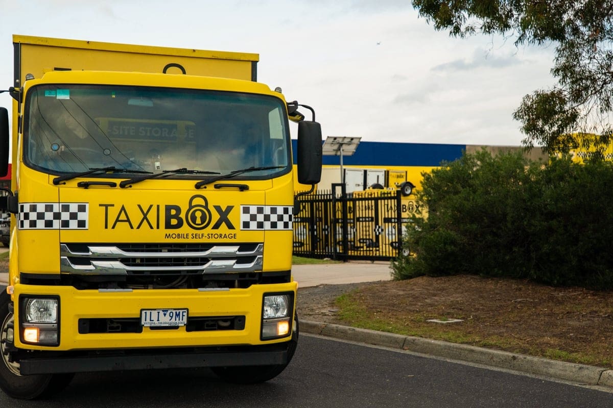 Yellow TAXIBOX truck outside Canning Vale storage facility